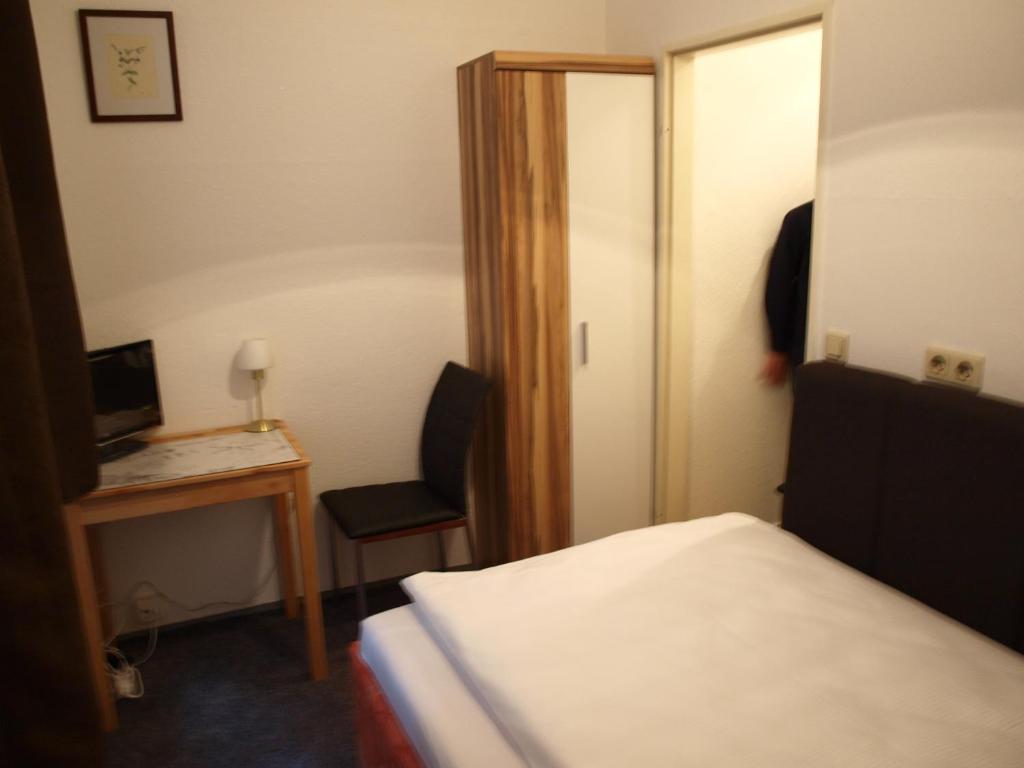 Postel nebo postele na pokoji v ubytování Hotel-Pension Dorma