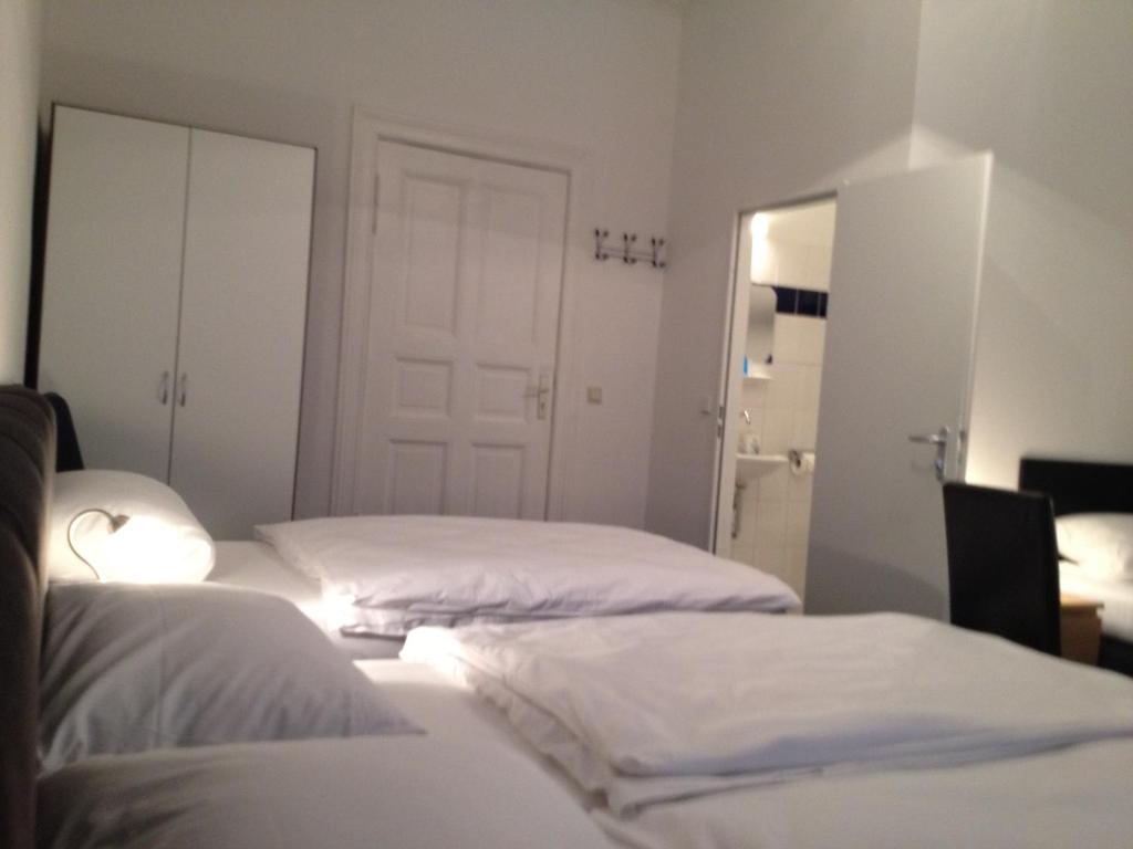 Postel nebo postele na pokoji v ubytování Hotel-Pension Dorma