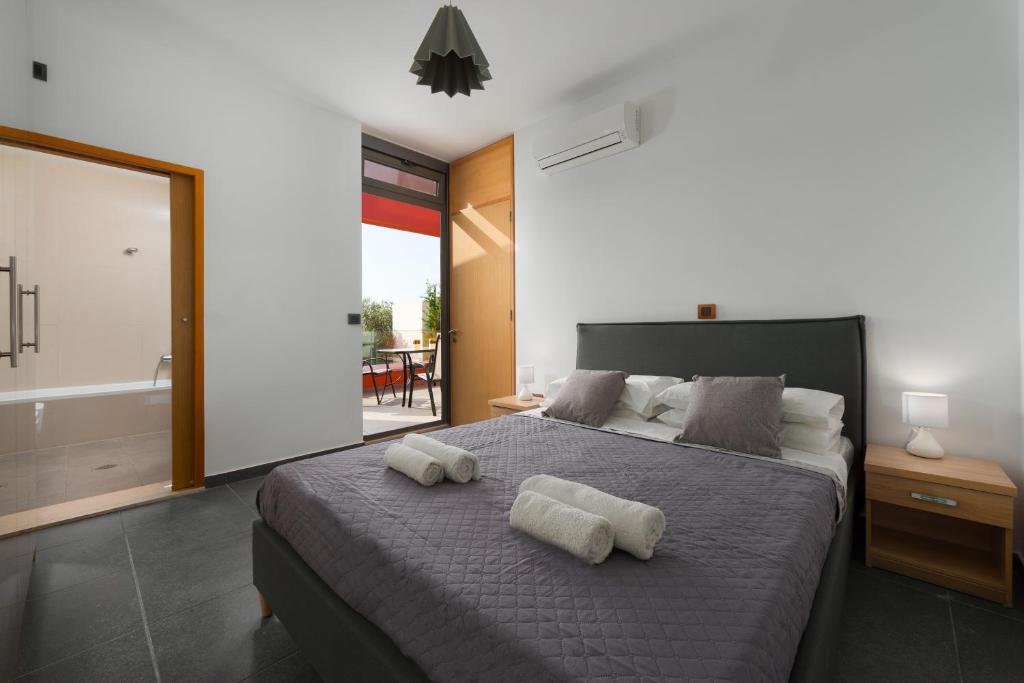 A bed or beds in a room at Almond Villa