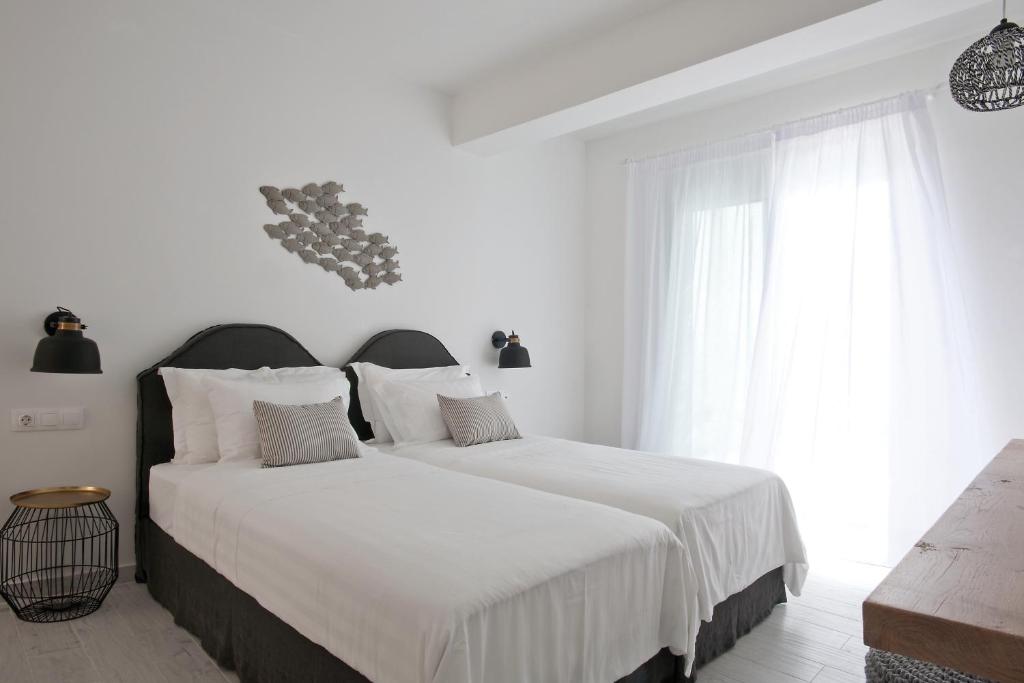 Postel nebo postele na pokoji v ubytování Elements Villas