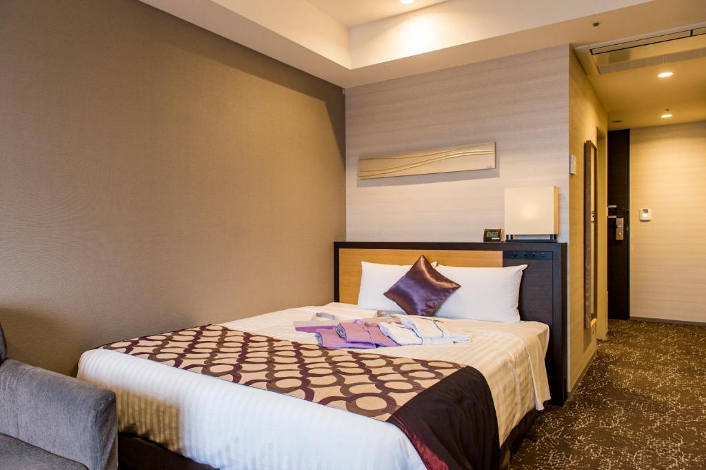 Postel nebo postele na pokoji v ubytování Hotel Ole