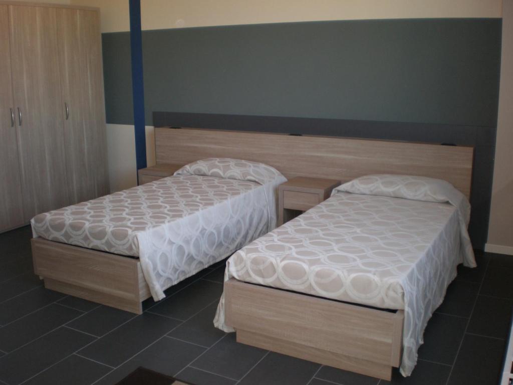 Postel nebo postele na pokoji v ubytování Valtidone Hotel