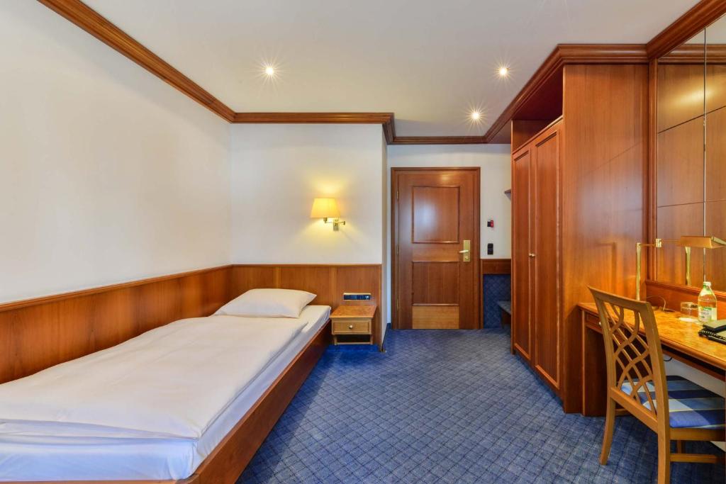 Postel nebo postele na pokoji v ubytování Hotel Fischerwirt