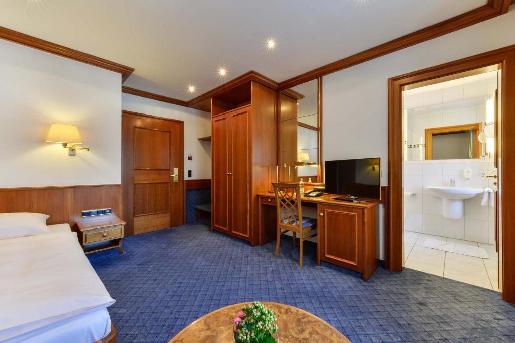 Postel nebo postele na pokoji v ubytování Hotel Fischerwirt