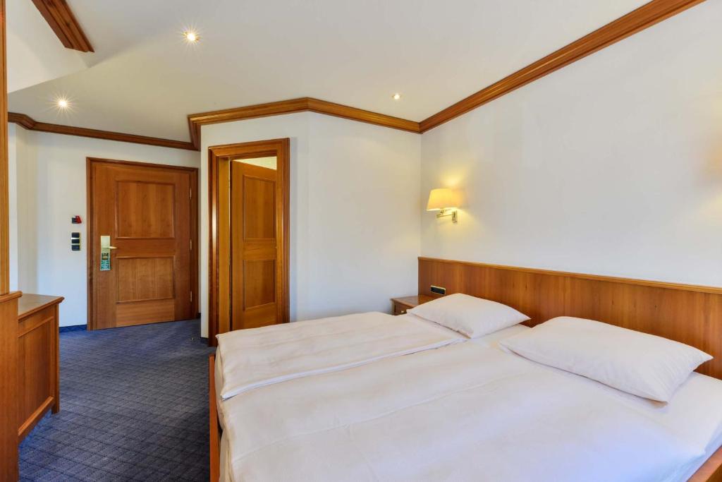 Postel nebo postele na pokoji v ubytování Hotel Fischerwirt