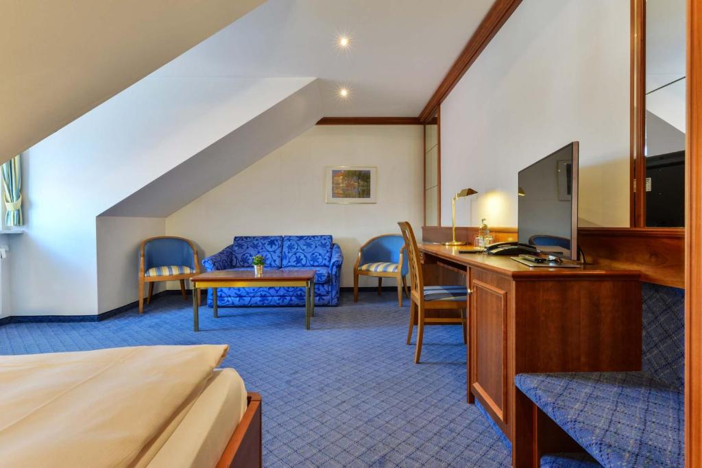 TV a/nebo společenská místnost v ubytování Hotel Fischerwirt