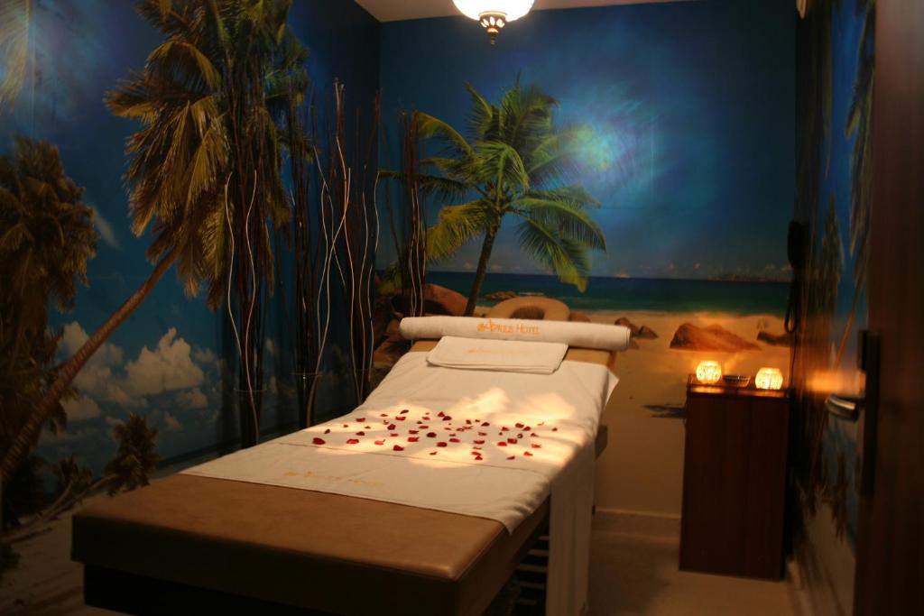 A bed or beds in a room at Aprilis Hotel - Special Category
