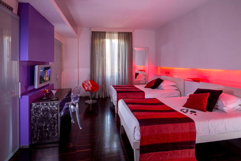 Postel nebo postele na pokoji v ubytování Hotel Ariston