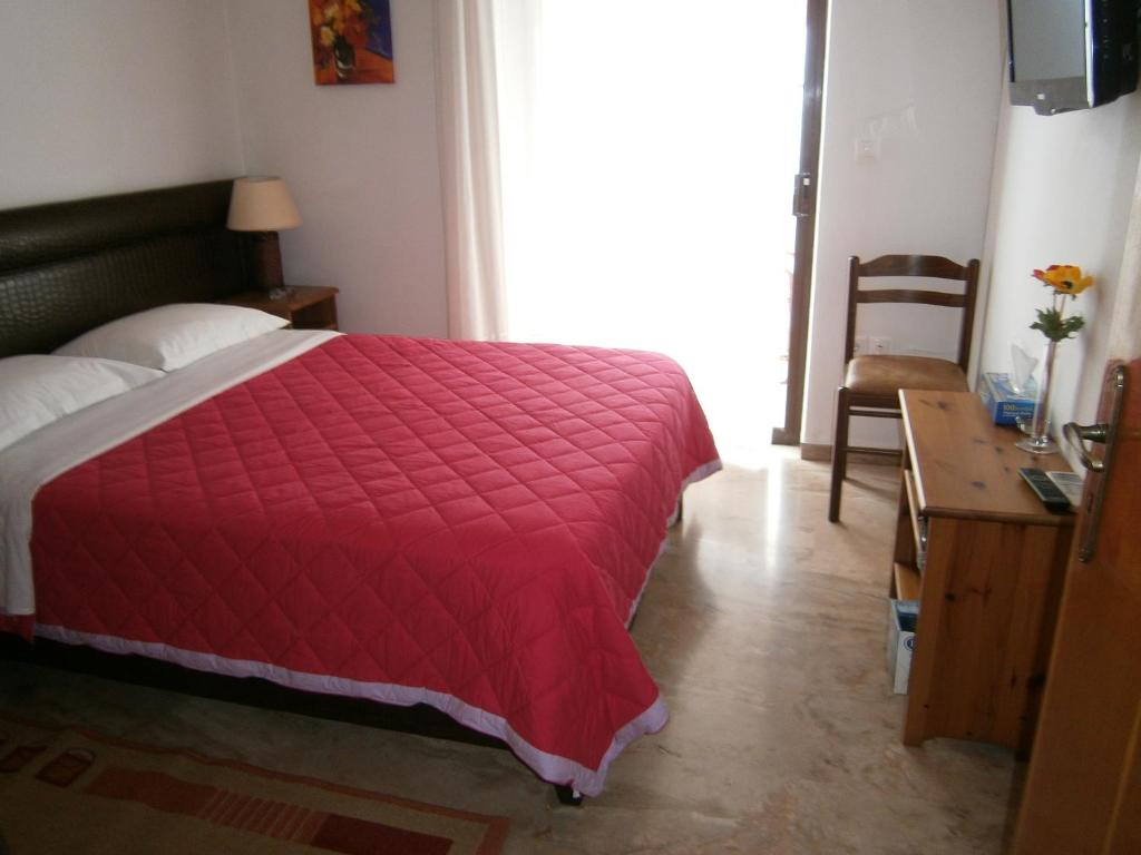 Postel nebo postele na pokoji v ubytování Antonios Rooms