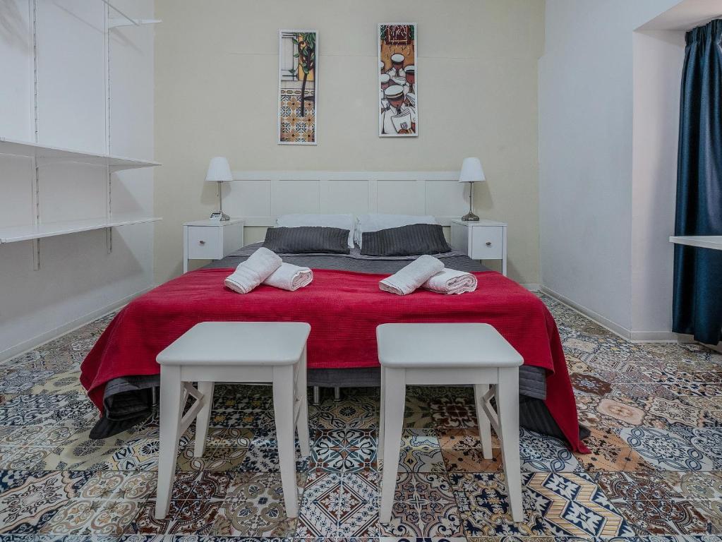 Postel nebo postele na pokoji v ubytování Valletta Ajkla Mansion