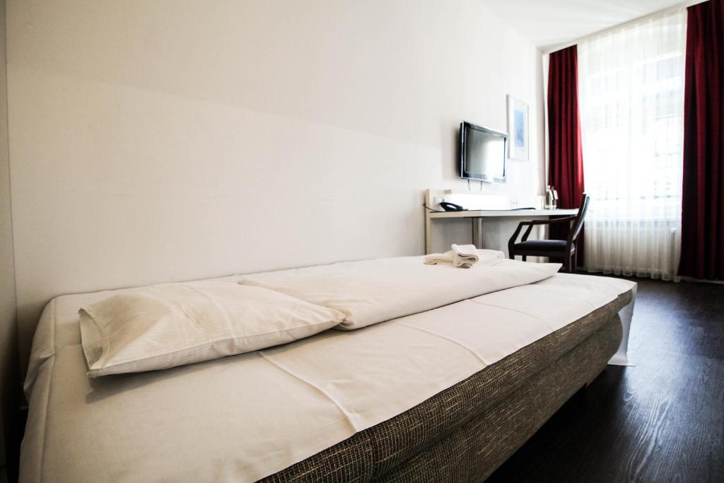 Postel nebo postele na pokoji v ubytování Hotel Prens Berlin