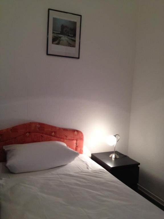 Postel nebo postele na pokoji v ubytování Hotel-Pension Dorma