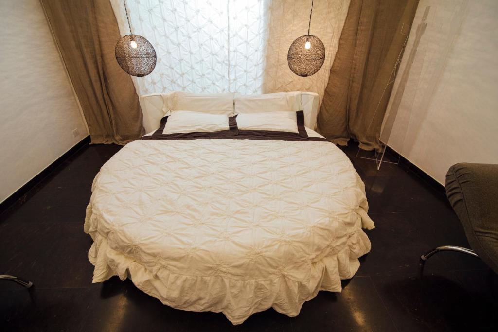 Postel nebo postele na pokoji v ubytování Atmosfere Puniche b&b