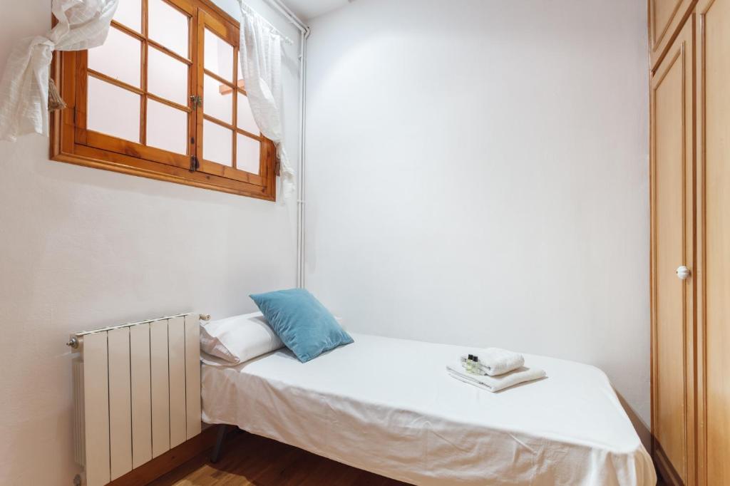 Postel nebo postele na pokoji v ubytování Flateli Aribau