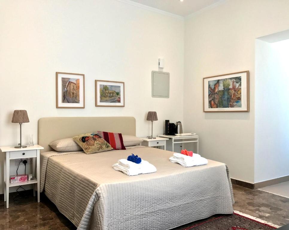 Postel nebo postele na pokoji v ubytování Avgi's Home