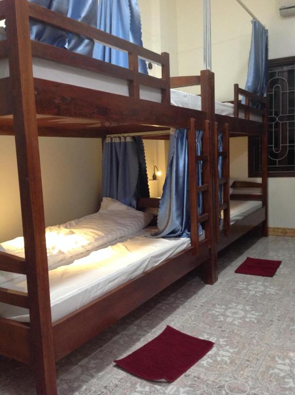 Postel nebo postele na pokoji v ubytování Ha Giang 1 Hostel and Loop Tour
