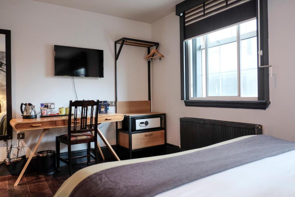 Postel nebo postele na pokoji v ubytování The Wellington Hotel