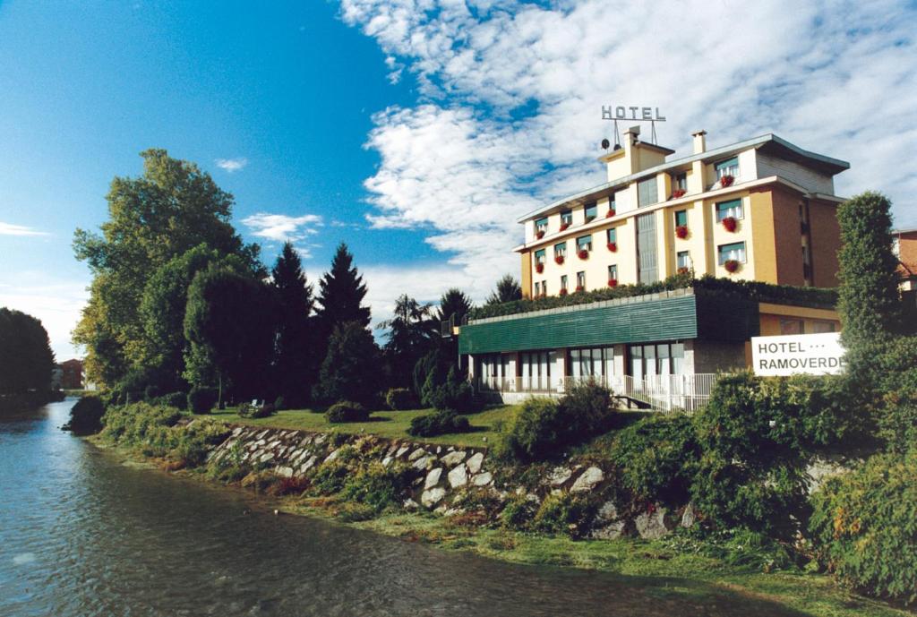 a hotel on the side of a river at Hotel Ramoverde in Borgomanero