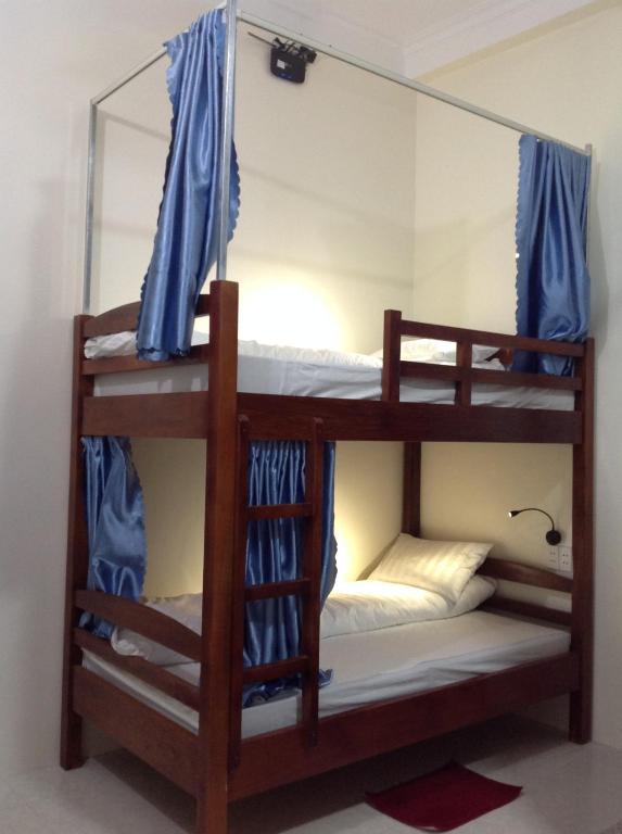 Postel nebo postele na pokoji v ubytování Ha Giang 1 Hostel and Loop Tour