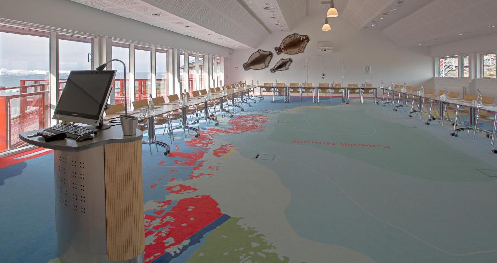 a swimming pool with a painting on the floor at Hotel Arctic in Ilulissat