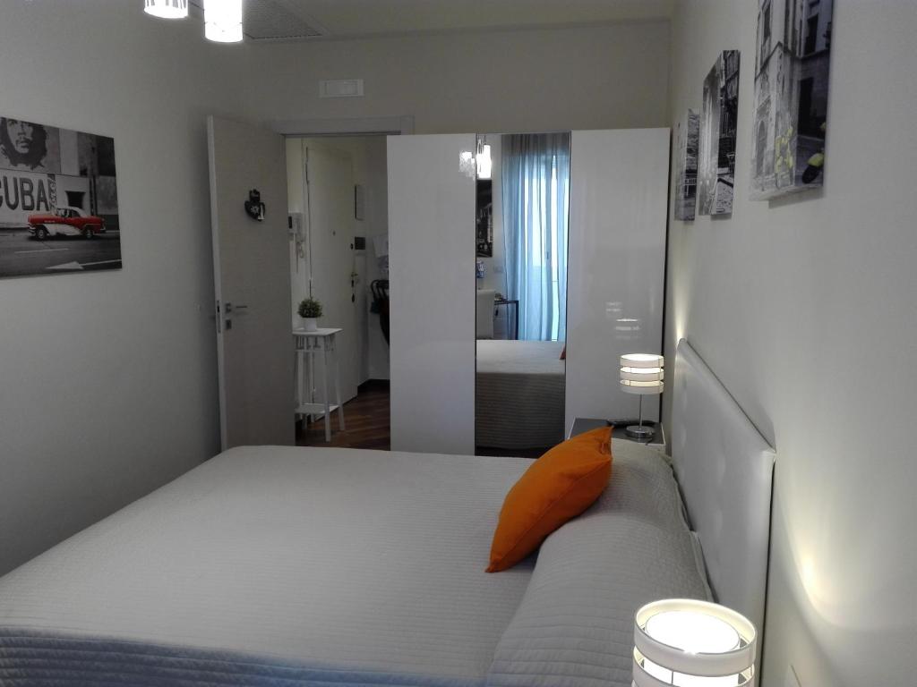 Posteľ alebo postele v izbe v ubytovaní Residenza Piazza Moro