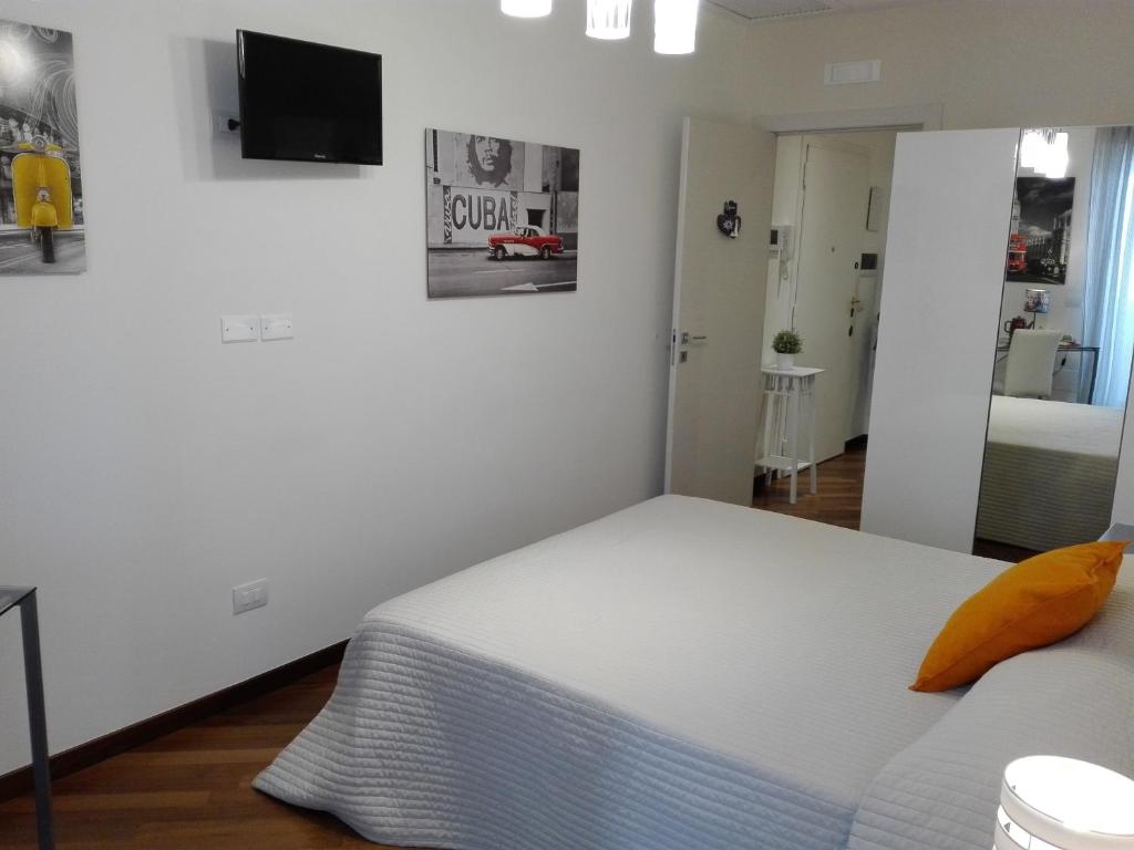 Posteľ alebo postele v izbe v ubytovaní Residenza Piazza Moro