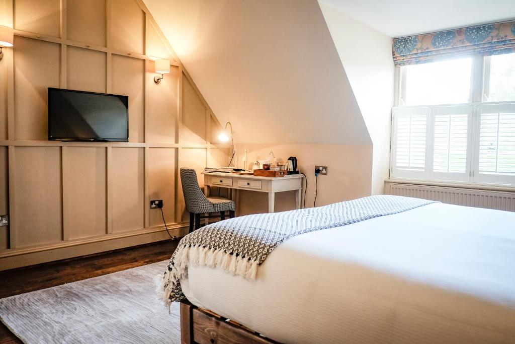 Letto o letti in una camera di The White Buck