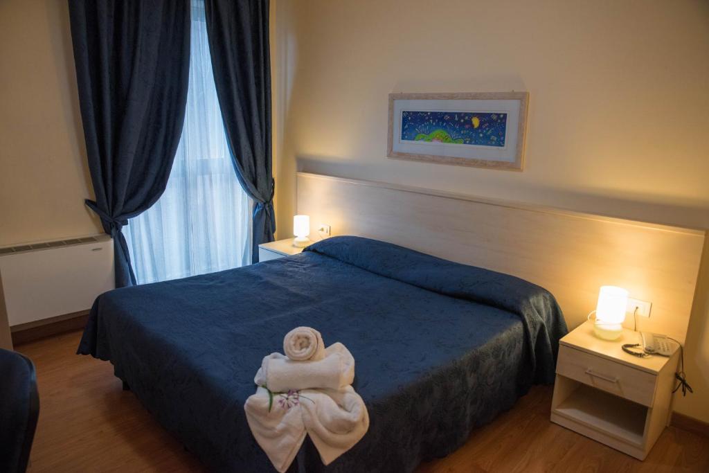 Postel nebo postele na pokoji v ubytování Hotel Break House Ristorante