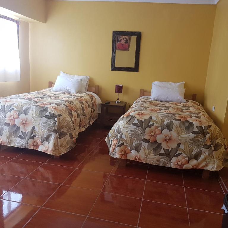 Postel nebo postele na pokoji v ubytování Hospedaje Familiar Kitamayu Pisac
