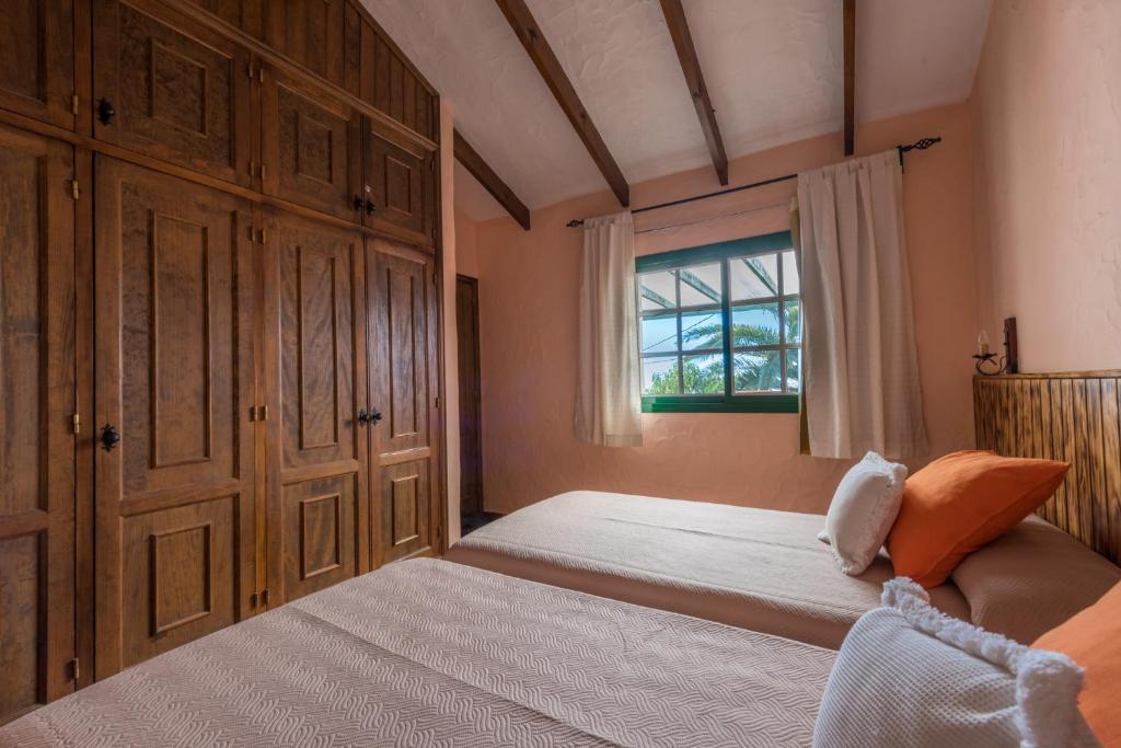Postel nebo postele na pokoji v ubytování Casa Abuela María