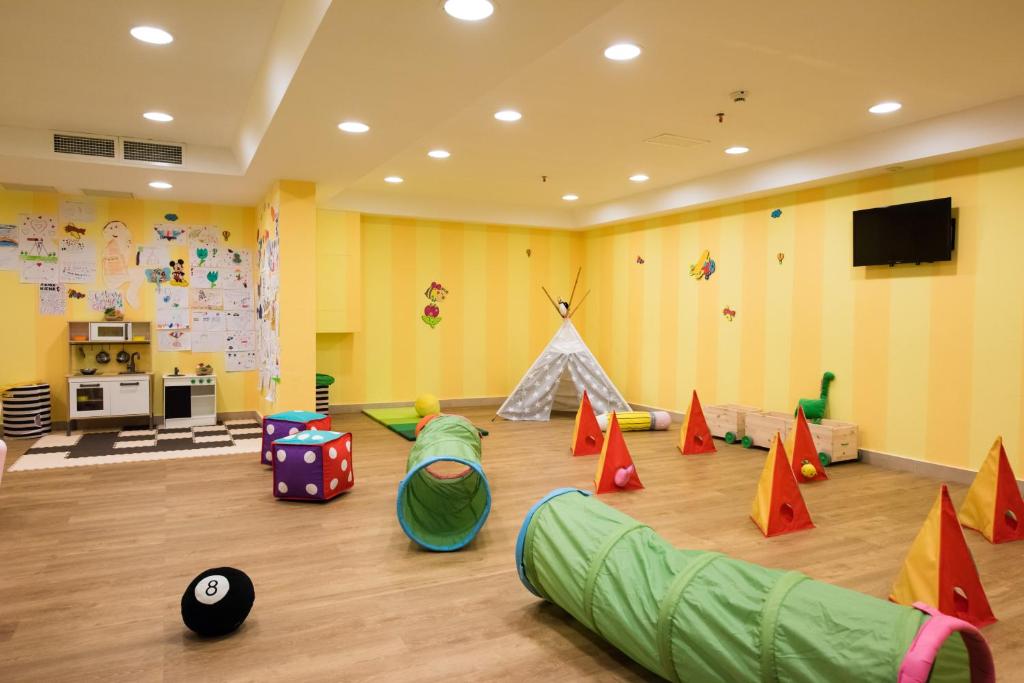 a room filled with lots of different colored play equipment at Alimounda Mare Hotel in Karpathos