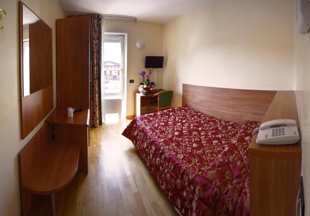 Postel nebo postele na pokoji v ubytování Hotel Brennero