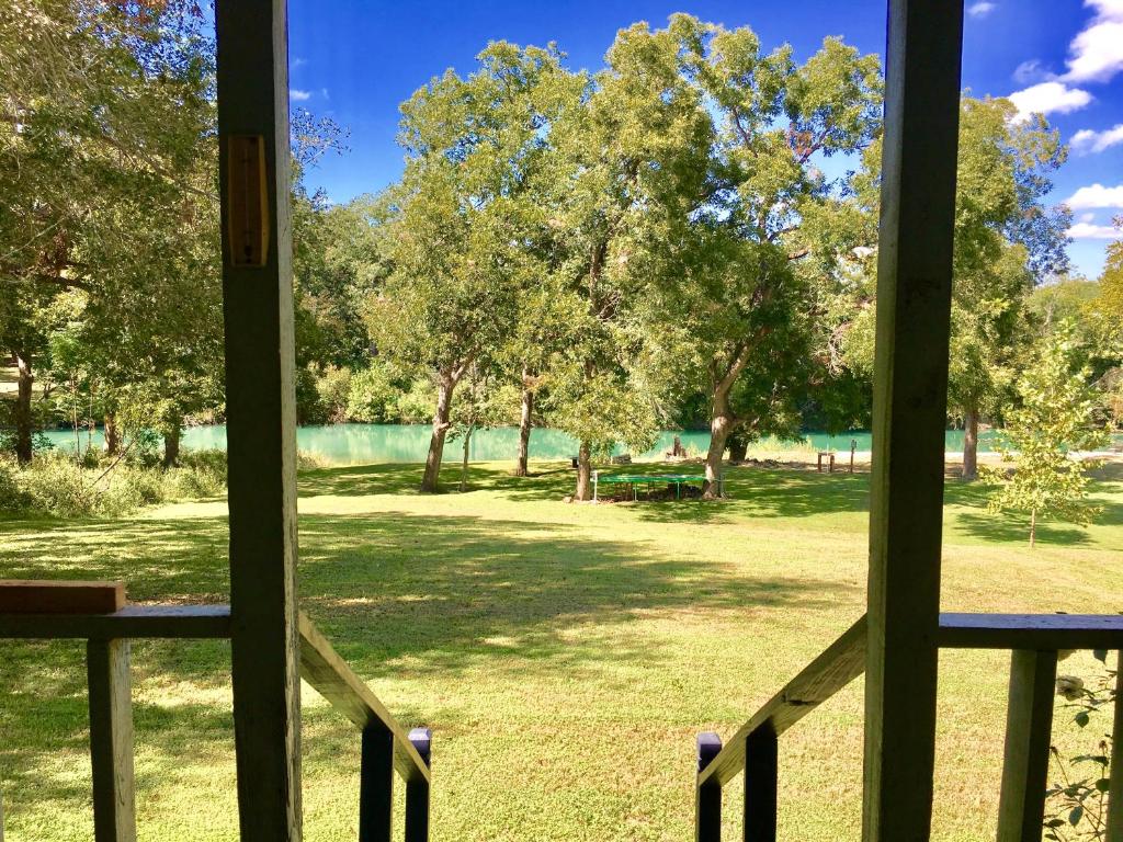 a view of a park from a window at The River House in San Marcos
