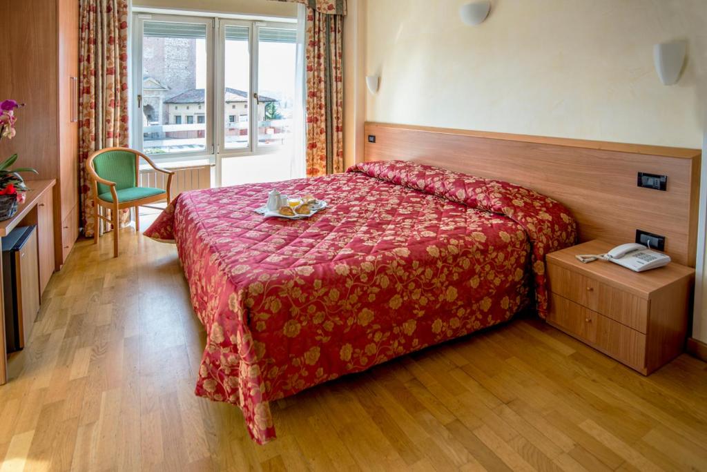 Postel nebo postele na pokoji v ubytování Hotel Brennero