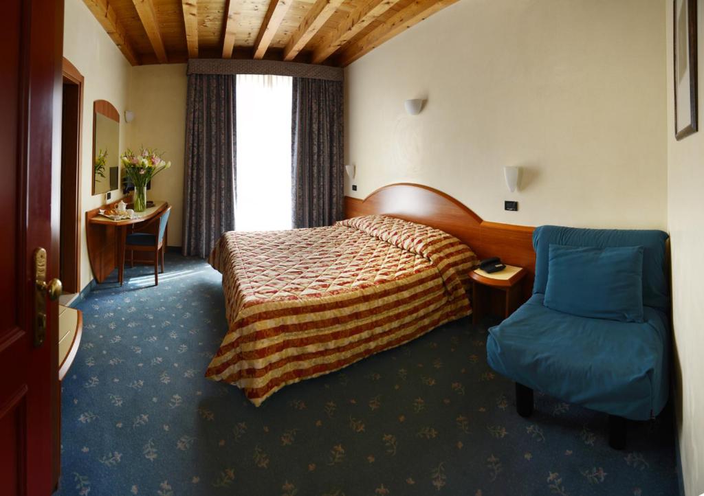 Postel nebo postele na pokoji v ubytování Hotel Brennero