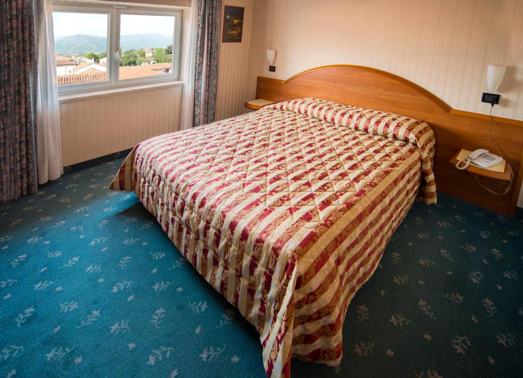 Postel nebo postele na pokoji v ubytování Hotel Brennero