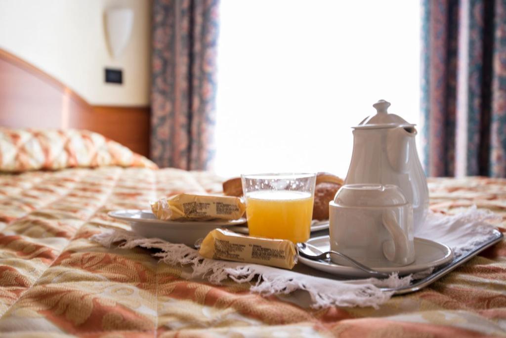 Postel nebo postele na pokoji v ubytování Hotel Brennero