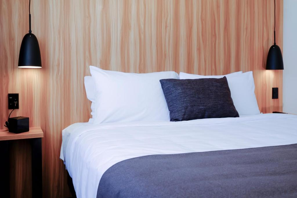 Postel nebo postele na pokoji v ubytování No. 9 Hotel