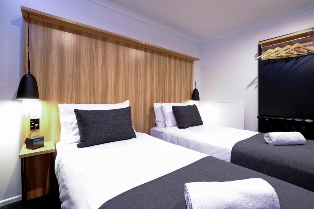 Postel nebo postele na pokoji v ubytování No. 9 Hotel