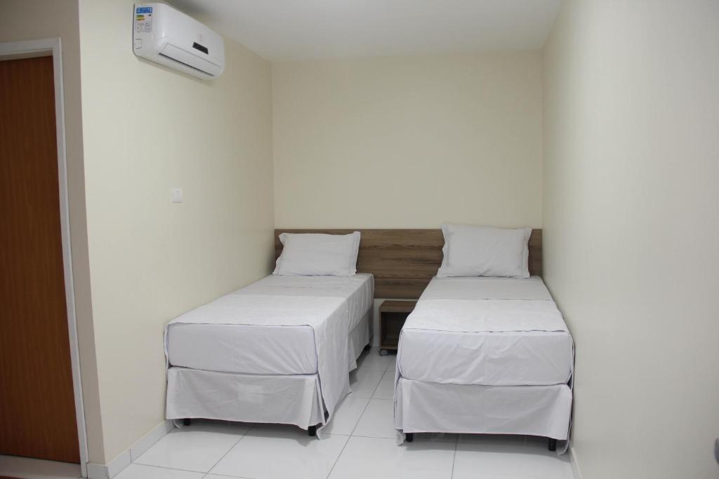 Postel nebo postele na pokoji v ubytování Hotel Executive