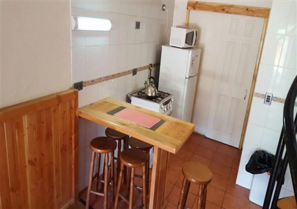 Kuchyň nebo kuchyňský kout v ubytování Casona Familiar Pucon Centro