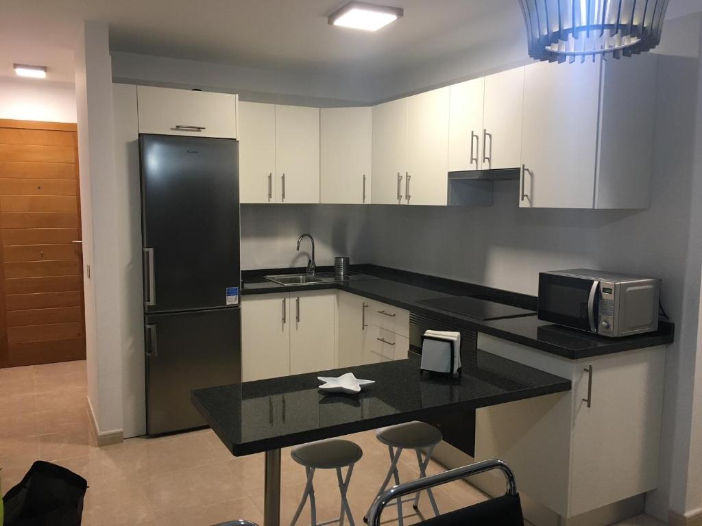 Kuchyňa alebo kuchynka v ubytovaní Residencial La Perla