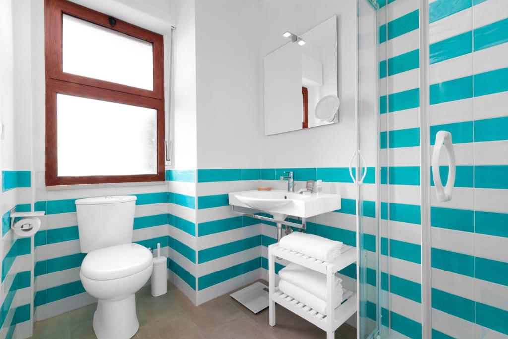 Koupelna v ubytování Sirocco Suites