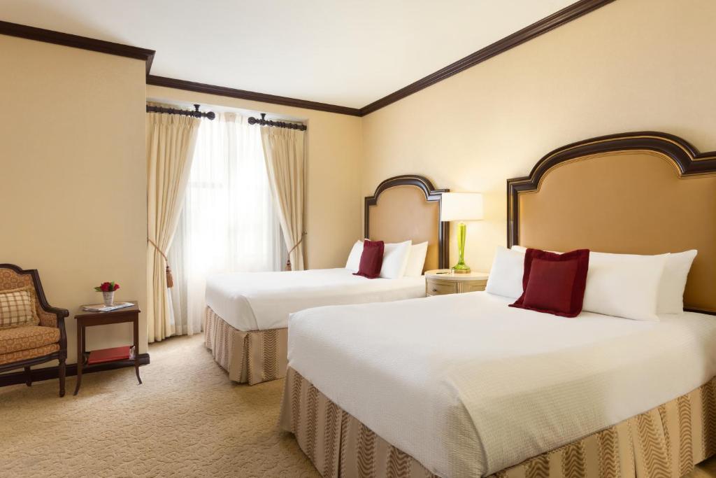 Postel nebo postele na pokoji v ubytování Hotel Du Pont