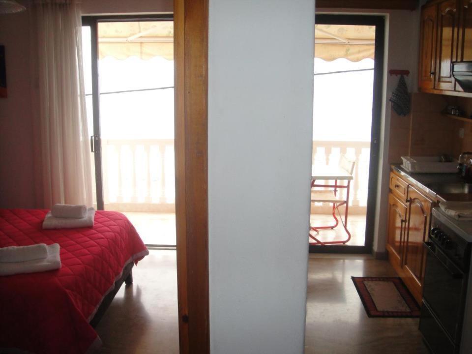 Postel nebo postele na pokoji v ubytování Antonios Rooms