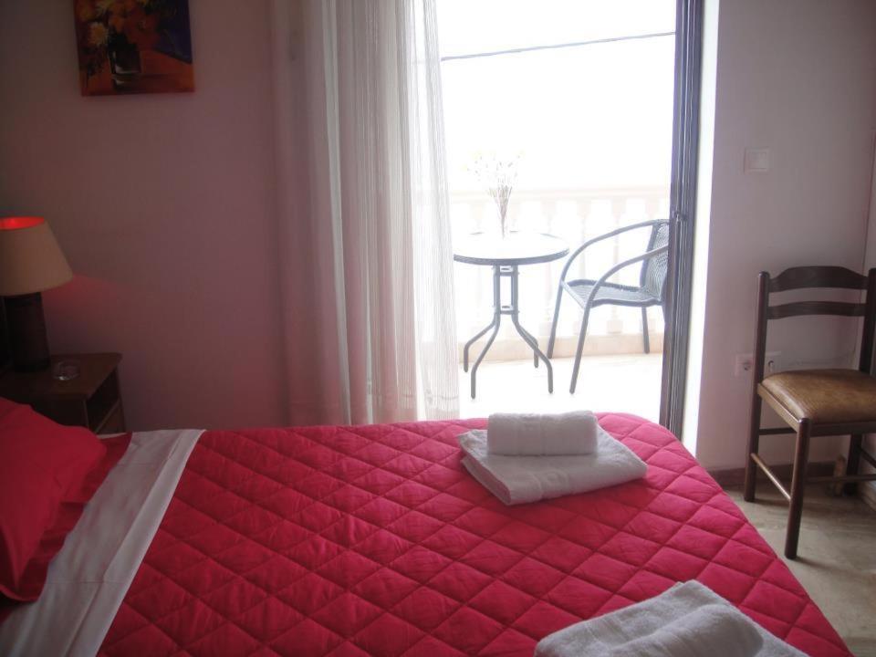 Postel nebo postele na pokoji v ubytování Antonios Rooms