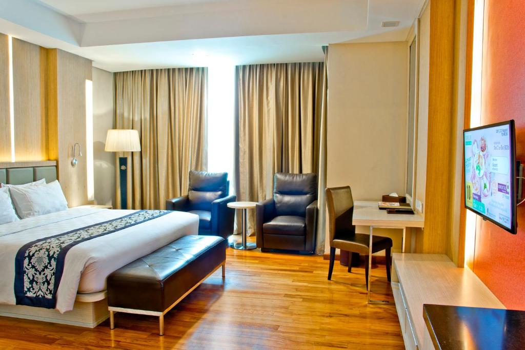 Postel nebo postele na pokoji v ubytování Nagoya Hill Hotel Batam