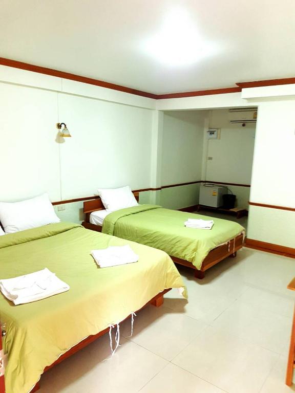 Postel nebo postele na pokoji v ubytování Rayong Phurua Resort