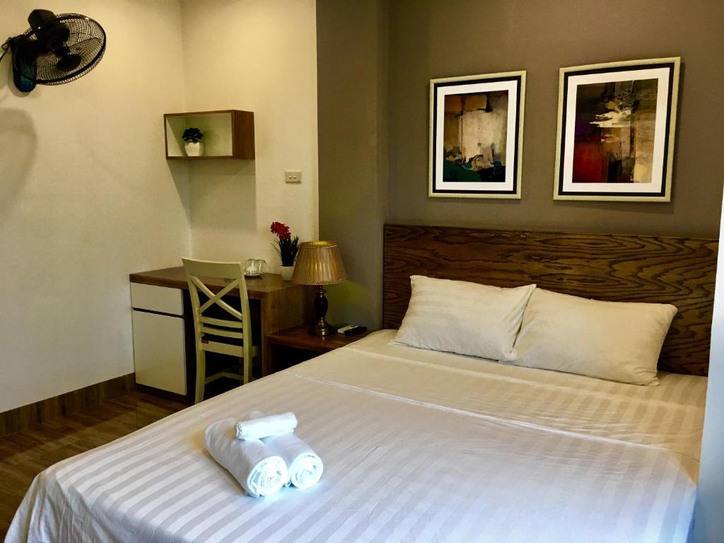 Postel nebo postele na pokoji v ubytování V House 5 Serviced Apartment