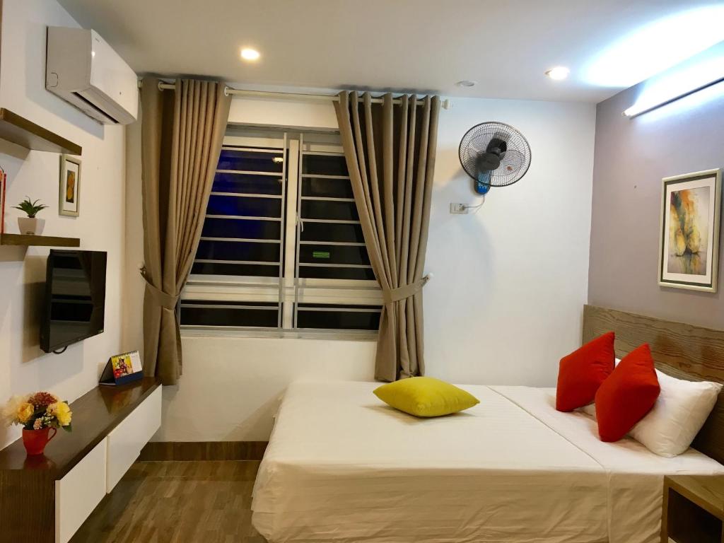 Postel nebo postele na pokoji v ubytování V House 5 Serviced Apartment
